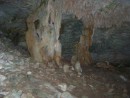 Stalactites and stalagmites fuse into a curtain in the cave on Great Guana near Little Farmer
