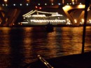 A cruise ship on the other side of the bridge.