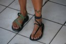 Lisa trying on locally made recycled tire sandals