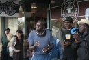Black gospel crew singing outside the original Starbucks store in Pike market