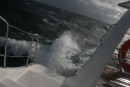 Waves breaking on the back of the boat