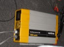 Inverter makes A/C )house current) out of D/C (12 volt battery power0