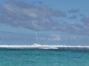 A sailboat outside the reef... now you see it, and