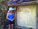 Rose standing next to the park sign.