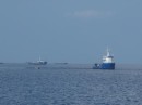 There are a couple supply barges in
the area.  They can supply fuel and water and take trash off the vessels in
the area.