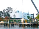A large car cargo ship transiting the canal; the photo was taken from the inner harbor of South Chesapeake City