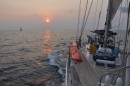 Sunset offshore of Costa Rica.  S/V Perfect Wave is in the distance.