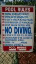 Refer to Line 7: This sign was at a pool in Punta Gorda, FL. After a very careful inspection of the water, I decided it was safe to go in. It occured to me that given the average age of the folks in Punta Gorda, there probable was a great deal of truth to the adage that at a certain point in one