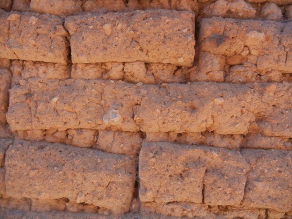 A close up of adobe brick.