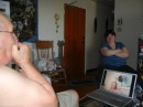 Dad (in Winnipeg) playing the harmonica while skyping with Linda and sister Ann in the background.