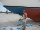 Ian painting the bottom paint on.