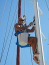 Ian cleaning the mast.