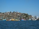 Colourful fishboats and the houses on the hill in Topolobampo.