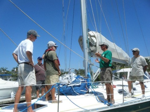 The foredeck crew gets directions from the skipper