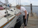 Becky putting the 5th coat of varnish on the starboard side.