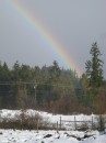 Rainbow coming down on the farm