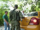 Alfredo, the taxi driver being asked by the Police to open the trunk at a random checkpoint on the way up to Minca in the mountains.