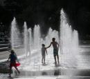 Children playing in one of the fountains in Quebec City.