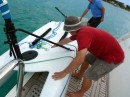 Lowering the Hobie into the water