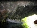 The dinghy tied up inside the cave