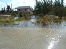 Seawater flooding slowly receding at West End, Grand Bahama