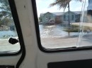 Seawater flooding surrounds many homes at West End Grand Bahama