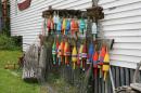 Colourful lobster buoys on the side of a house in Boothbay, Maine, USA
