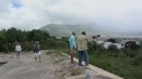 Our guide showing Don the vast expanse of the devastation caused by repeated volcanic eruptions on the island.  The picture was taken poolside at what use to be a resort. 