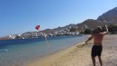 Don flying a kite on beach in Serifios