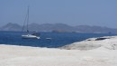 Koinonia II on anchor off of beach in Milos.  Victoria and Emily swam to shore, while Linda and Don kayaked ashore. 