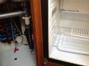 Shown here is the separate 12 volt freezer with lots of storage and the water distribution manifold installed under the sink.  Also installed under the sink is the boats fresh water pump and tank valves as well as the interconnection for the water maker output.  The later also features a separate valve to allow you to fill bottles directly from the water maker.