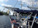 As seen in this picture, Koinonia II is outfitted with 250 watts of solar panels, a D400 wind turbine, and a wifi antennae for picking up those shore hotspots from miles away.  Included is a stern mounted American flag.  Koinonia II is a US documented vessel!