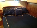 The owners cabin is very comfortable with a queen size inner spring mattress and custom decorative bedding, private access to the aft head and shower, lots of storage on 3 sides of the bed with additional storage under the mattress deck, and a cedar lined closet with hanger space and shelves.  Storage is everywhere on the Hunter 41DS!