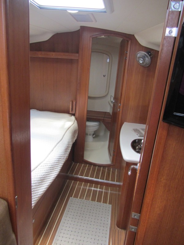 Looking forward from the salon, the Hunter 41DS features a private guest suite with a full size berth, head, shower, vanity with sink, and a cedar lined closet.