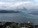 From top of the volcano Raiatea. Fringing reef and the passes. Also a few small motu where folks live can be seen if you look close. 