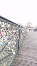 Pont des Arts, where lovers fasten a padlock to the bridge to signify their love.