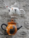 Teapots outside a ceramics shop.
