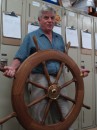 Frank holding the wheel for Farfarer for the first time. Covey Island Boatworks Riverport