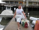 Nancy Montgomery modelling the latest in low-budget rainware, a garbage bag scrounged from a restaurant when caught in an unexpected dounpour, Fernandina Beach, Fla.