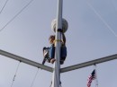Neil half way up the mast trying to fix our deck light.