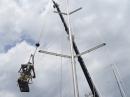Julian attaching the wind instruments back on top of the mast