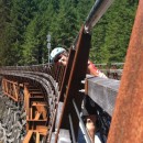 Carol on the long curvy railroad bridge in Canada
