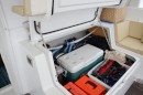 Cockpit mega-storage locker for tools, toys, and an extra chilly box cooler.