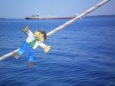 Flat Stanley waving to a passing freighter.