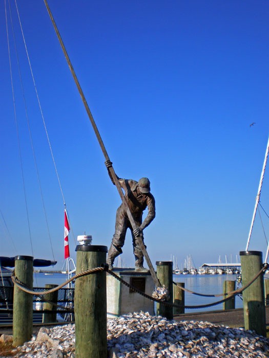Oyster Man statue at the town wall in Rock Hall. We tied up here overnight and bought our crab trap, chicken neck bait, and a few other must have items from the bait shop.