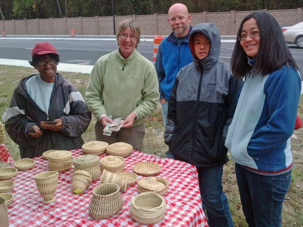 Buying sweetgrass baskets from Miss Anne at a roadside stand on Sullivan