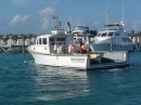Lobster boat from MA. leaving the slip next to Piper after coming up for lunch from Man-o-War Cay