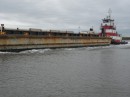 Tug pushing barge on the Harbor River