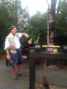 A docent who represents a carpenter at the replica of the English settlement. He demonstrates turning a chair leg.