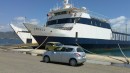 Ferry and hire car.
